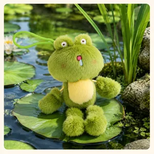 Cute frog plush toy pendant detail shot showing soft green texture sitting on natural lily pad.