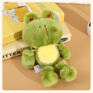 Cute green plush frog doll pendant detail showing soft fabric and long dangling legs.