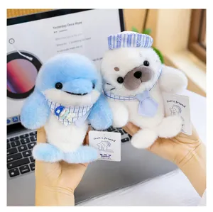Cute plush dolphin and seal toys detail view, soft stuffed animal companion for desk decor.