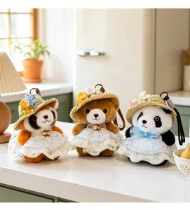 Cute plush animal bag pendant featuring pandas and bears in straw hats and lace dresses.