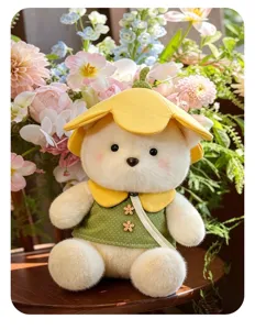 Cute flower bear plush toy with yellow hat and green polka dot dress, soft stuffed animal doll.