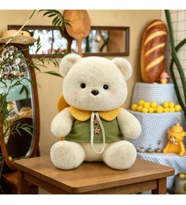 Plush teddy bear toy featuring a fluffy white body and a cute green polka-dot dress detail.
