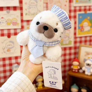 Cute plush seal toy detailed view, soft stuffed animal wearing sailor hat and tie for desk decor.