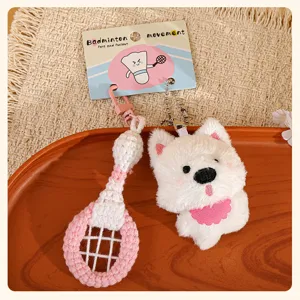 Cute plush dog and badminton racket keychain set, soft stuffed toy bag charm pendant accessory.