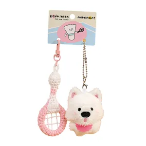 Cute badminton and puppy plush keychain pair, sweet pink and white design for bags and keys.