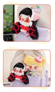 Cute plush doll pendant detail showing gothic and curly hair styles hanging on a backpack.