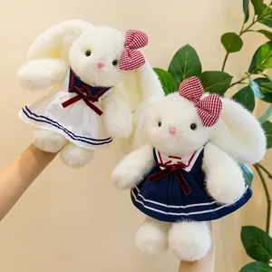 Cute floppy-eared rabbit plush toys in sailor dresses with red bows, soft companion gifts.
