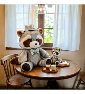 Adorable gentleman raccoon plush toy with silver hat and bow tie, soft stuffed animal gift.