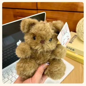 Fluffy brown bear plush toy pendant, detail view showing soft fur texture and cute charm.