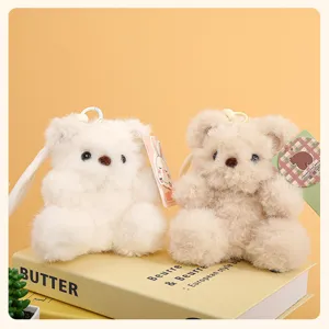 Cute plush teddy bear keychain detail, soft fluffy toy pendant for keys, bags and phone charms.