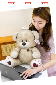 Cute teddy bear plush toy detail shot, soft stuffed animal doll for kids birthday gifts.