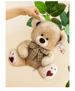 Cute teddy bear plush toy with plaid bow and heart paws, soft stuffed doll for kids gift.