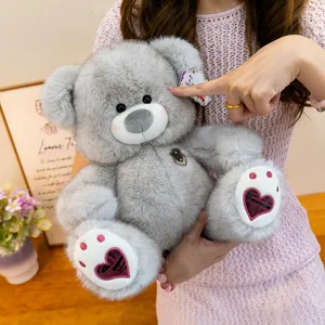 Cute grey fluffy teddy bear plush toy with heart foot pads, soft stuffed doll gift for kids