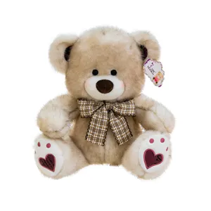 Cute teddy bear plush toy with plaid bow tie and heart paw pads, soft stuffed animal gift.