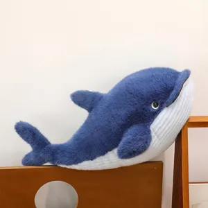 Soft blue plush whale toy detail, cute stuffed animal with fluffy fabric for kids.