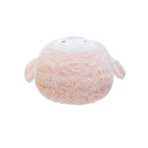 Close-up detail of the cute pink round plush pillow, soft fluffy texture, comfortable toy decor.