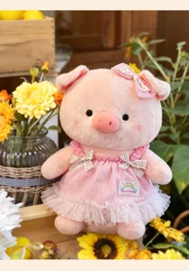 Detailed close-up view of the cute pink pig plush toy, featuring soft fabric and lovely dress.