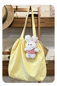 Fluffy white plush bunny rabbit pendant with yellow tote bag, soft toy gift charm.