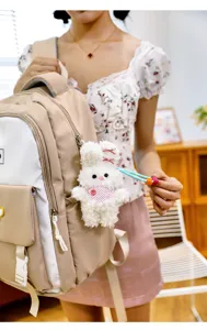 Cute plush rabbit pendant for backpack, soft fluffy bunny doll keychain, sweet gift accessory.