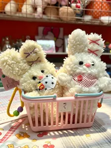 Soft cute plush rabbit pendant keychains set in pink basket, fluffy bunny doll gift details.