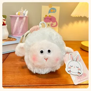 Cute fluffy sheep plush keychain detail, soft white toy pendant with cute googly eyes and strap.