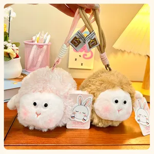 Cute fluffy round sheep plush toy bag charm keychain for cute backpack decoration.