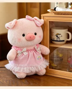 Cute pink plush pig doll toy with stripe dress and bow detail in cozy room setting detail.