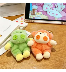 Plush dinosaur and monkey keychain toys detailed shot on wooden desk with cute props.
