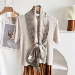 Detailed view of the silk wool blend double layer ribbon scarf with elegant print and styling.