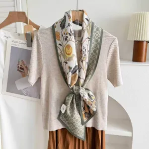 Stylish silk wool blend double layer ribbon scarf with retro floral print and green border.