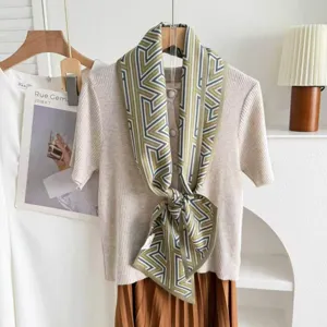 Silk wool blend double-layer ribbon scarf, elegant geometric print neckerchief detail.