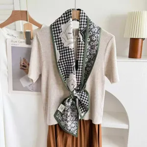 Detailed view of the double-sided silk blend ribbon neck scarf with houndstooth and art print.
