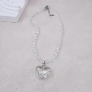 Details of the transparent crystal heart pendant necklace with clear beaded chain for women.