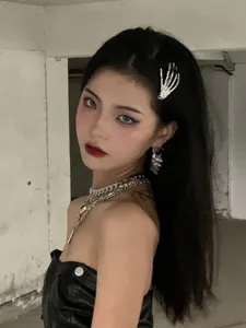 Edgy rhinestone skeleton hand hair clip for women, punk gothic side bangs styling hair accessory.