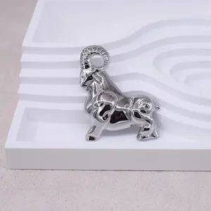 Detailed view of a vintage 3D silver ram brooch, elegant metal animal shape design for suit jackets.