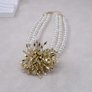 Exaggerated 3-layer pearl necklace with gold firework pendant for evening party detail.
