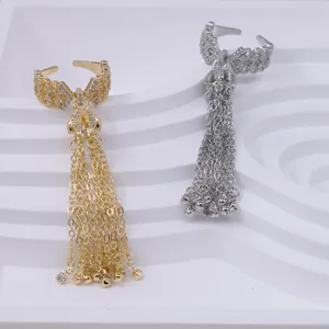 Elegant bow zircon tassel open ring set in gold and silver, stylish long chain finger jewelry.