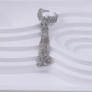 Silver bow tassel open ring for women, stylish cubic zirconia finger jewelry for daily wear.