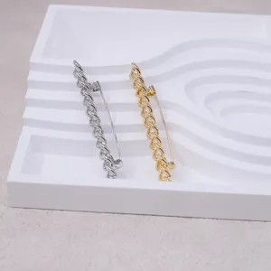 Stylish metal chain brooch lapel pin for women, elegant suit coat accessory in gold silver.