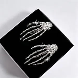 Silver rhinestone skeleton hand hair clip, gothic style side bangs clip fashion accessory.