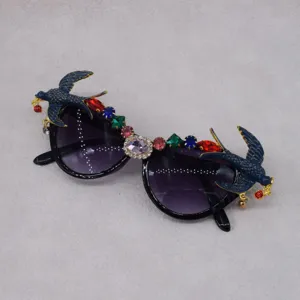 Luxury swallow crystal rhinestone sunglasses for women, fashion party vintage eyewear detail.