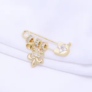 14k gold plated safety pin DIY jewelry charm with clear zirconia and fleur-de-lis pendant detail