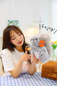 Detailed close-up view of the cute simulation rabbit fur squirrel plush toy with acorn.