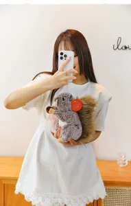 Simulation rabbit fur squirrel plush toy doll with nut prop, cute window display gift.