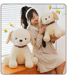 Detail view of a cute soft plush Labrador puppy toy with brown collar in a cozy home scene.