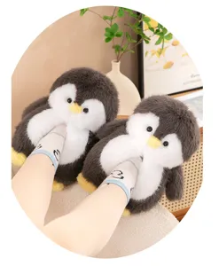 Cute winter penguin plush slippers for women, warm soft sole indoor home shoes detail shot.