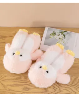 Fluffy penguin house slippers detail, cozy plush winter footwear for indoor comfort and warmth.