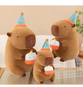 Cute capybara plush toy with birthday hat and cake, soft stuffed animal gift for kids.