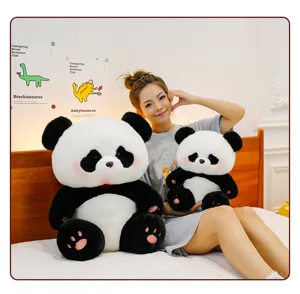 Cozy bedroom scene featuring adorable fluffy panda plush toys and smiling model companion.