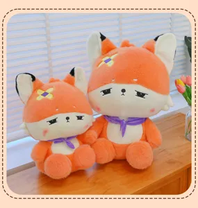 Detailed view of cute orange fox plush toys with purple scarf and band aid, soft material.